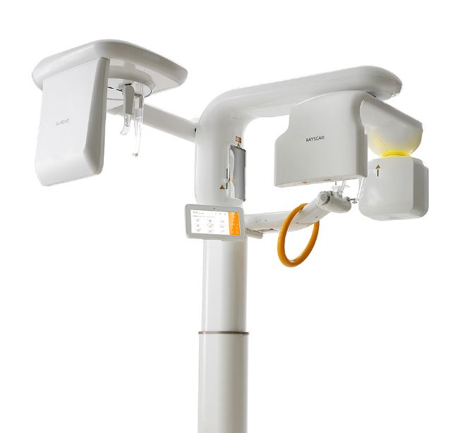 A photo of the white Rayscan Alpha CBCT x-ray machine